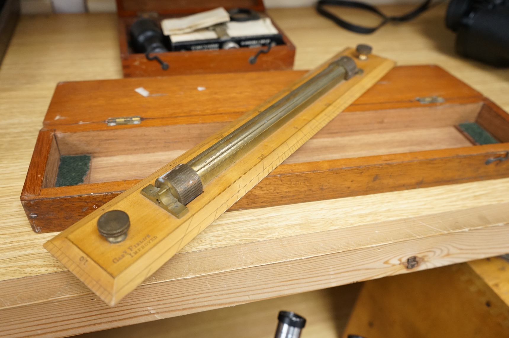 An early 20th century teak cased Stuart's Distance Meter and a late 19th century mahogany cased ‘Capt. Field’s Improved’ protractor by Gieves Ltd., 21 Old Bond Street W.1.